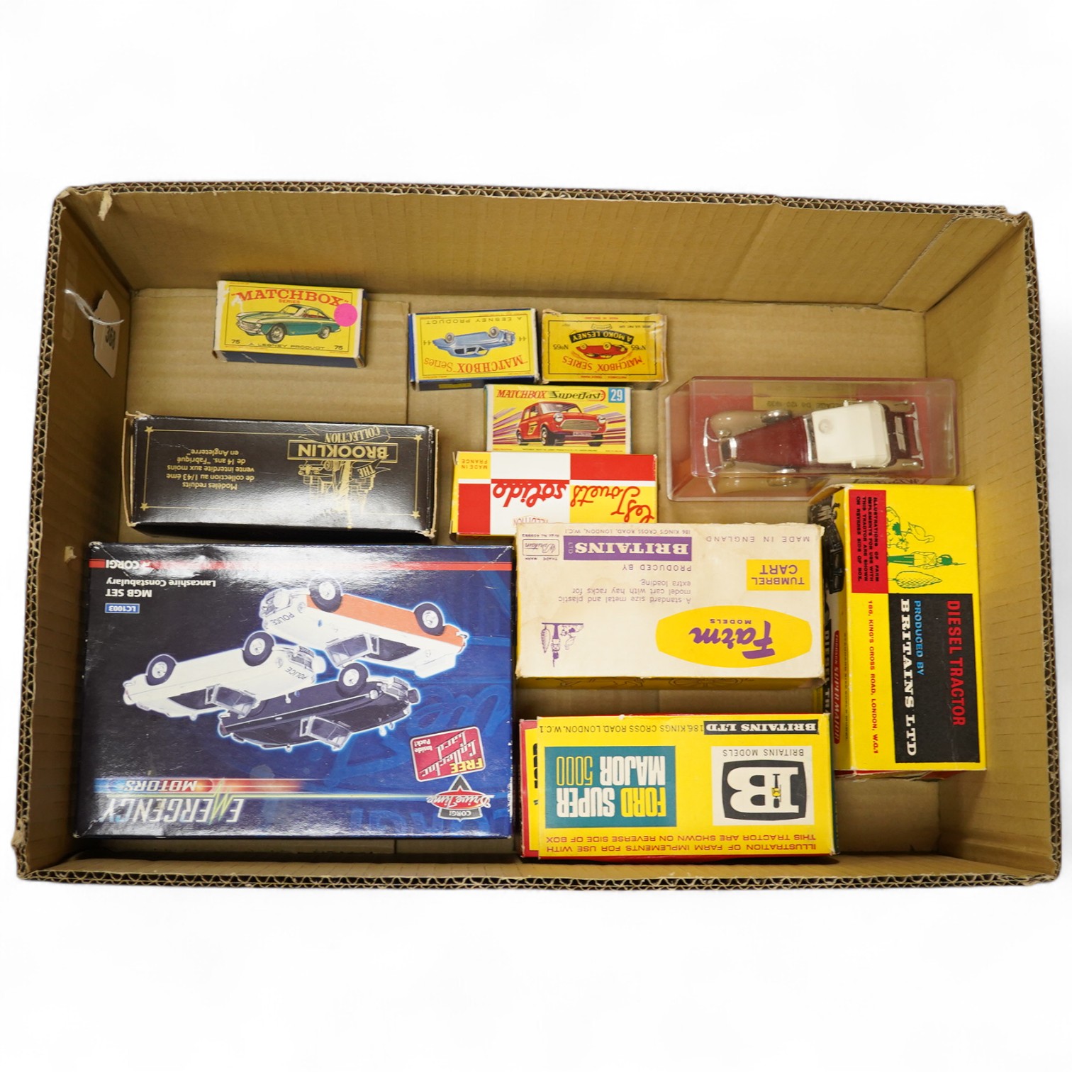 Eleven boxed diecast, etc. vehicles including three Britains; a Fordson Super Major diesel tractor (9525), a Ford Super Major 5000 diesel tractor (9527), and a Tumbrel Cart (9505), all boxed with inner card packing/displ